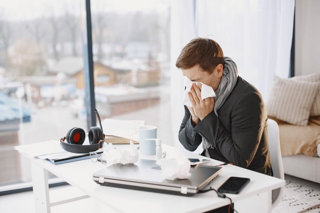 man with laptop is suffering with cough feeling bad businessman home 1157 48736